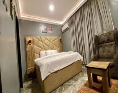 Standard Room at Fountain Blu Hotel and Apartment, Abeokuta with air conditioning, Wi-Fi, and a flat-screen TV, all within a warm, luxury and inviting atmosphere
