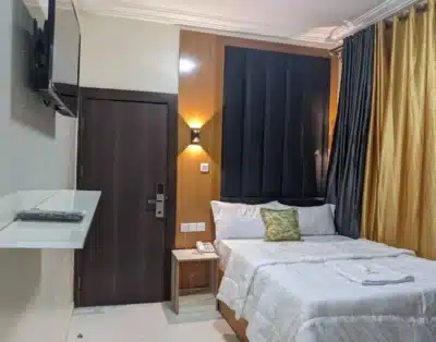 Standard Room at Billion Suites, Awka, Anambra with air conditioning, a flat-screen TV, high-speed Wi-Fi, and a private bathroom fitted with modern fixtures