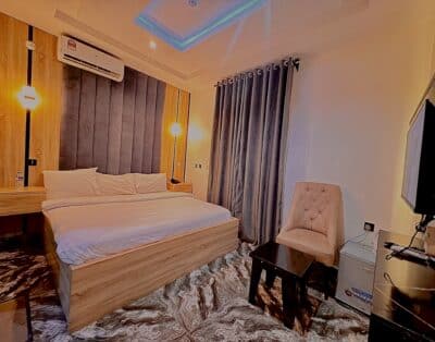 Studio Room at Mira Heights Hotel, Enugu with luxury living, air conditioning, high-speed Wi-Fi, a flat-screen TV, and a compact workspace